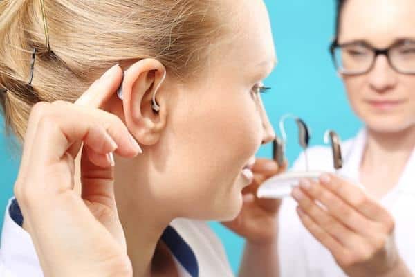 person-trying-on-a-hearing-aid-copy (1)