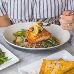 A plate with a cooked fish dinner.