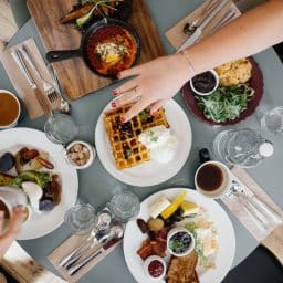 Shot of a round table with breakfast food at a restaurant.