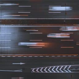 An aerial shot of car traffic on an expressway.