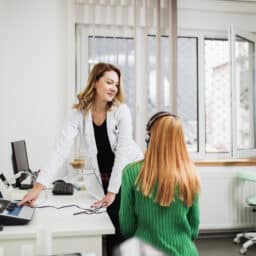 Audiologist conducting a hearing test