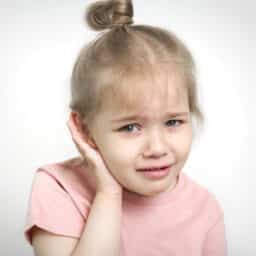 Young girl with ear pain