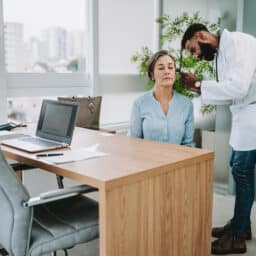 Audiologist examining a patient's ear